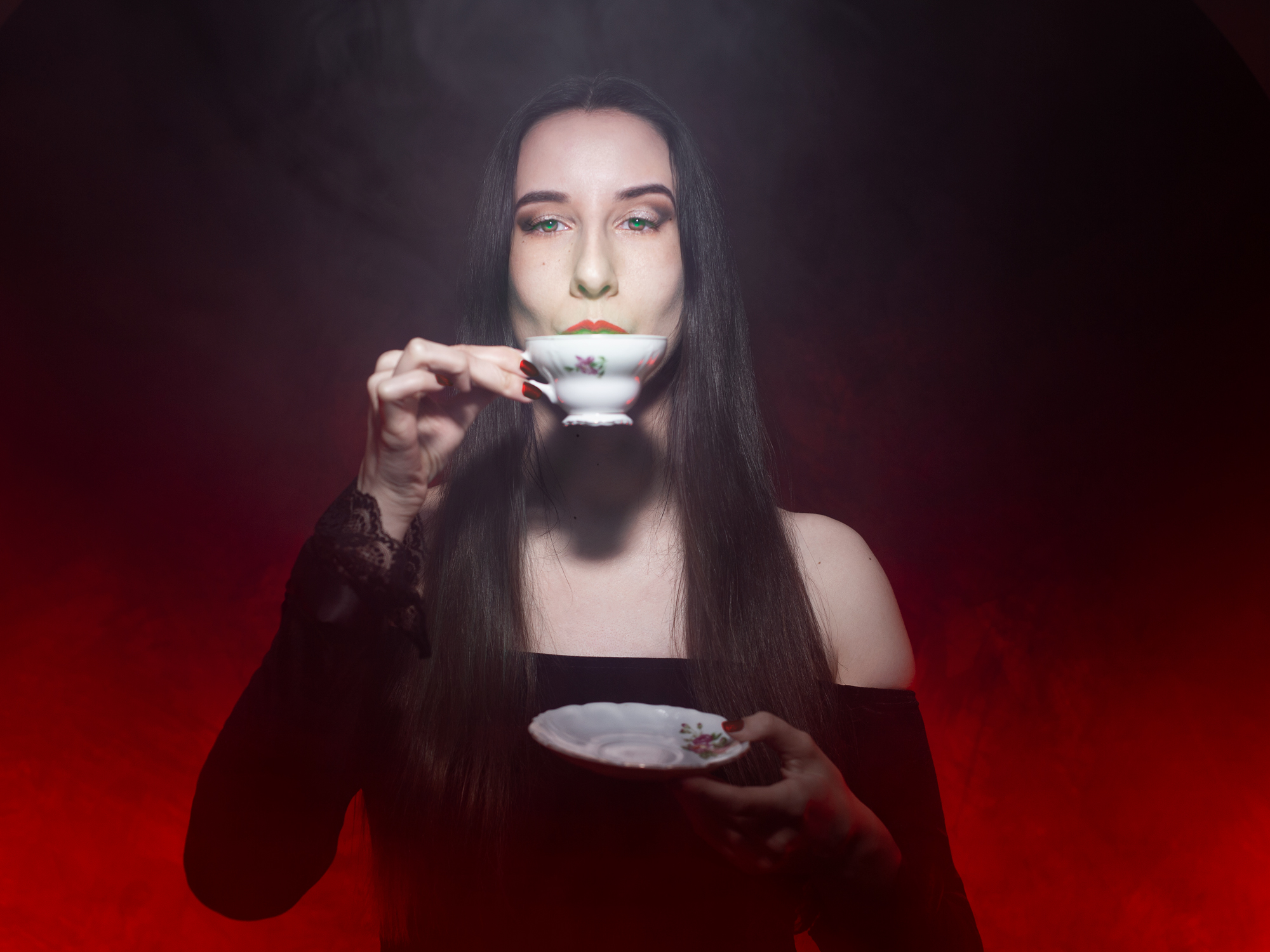 Self portrait as Morticia Addams drinking tea.